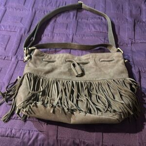 Purse brand is FOSSIL 9 1/2 inches long 11 inches wide